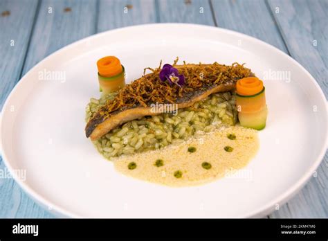 Recipe For Fried Fillet Of Sea Bass With Herb Risotto White Wine Sauce Fresch Creme Roll Of