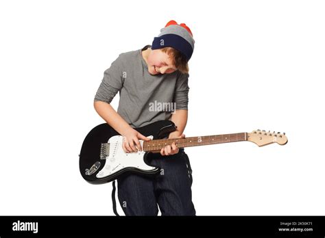 Niño tocando la guitarra electrica fotografías e imágenes de alta