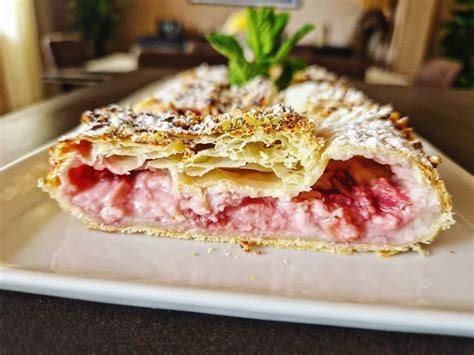 Strudel Like Filled With Milk And Strawberries Cream Topped With Honey And Crushed Pistachio