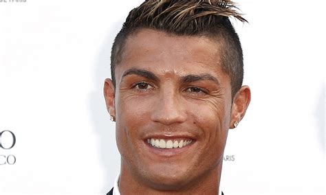 Cristiano Ronaldo sports a shiny face as he hits the red carpet at ...