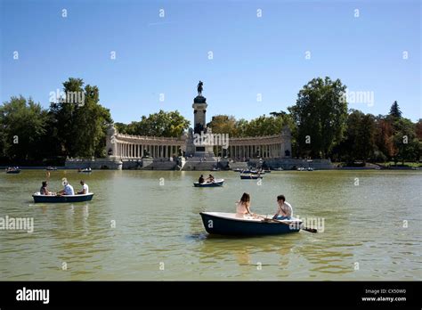 People boating on the lake in Retiro Park. The lake was originally part ...