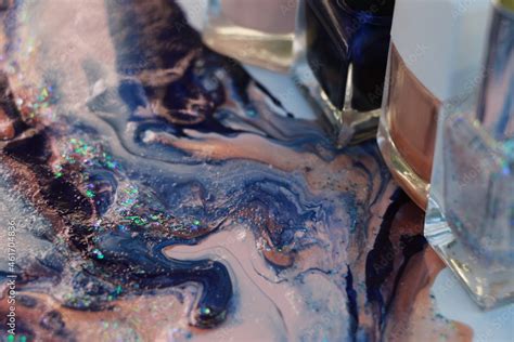 Nail Polish Of Blue Nude And Glitter Colors Forming An Artwork With Patterns Four Blurry