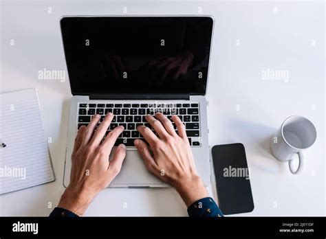Working at home with laptop Stock Photo - Alamy