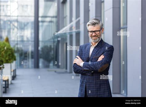 Portrait Of Mature Gray Haired Businessman Senior Boss Smiling And