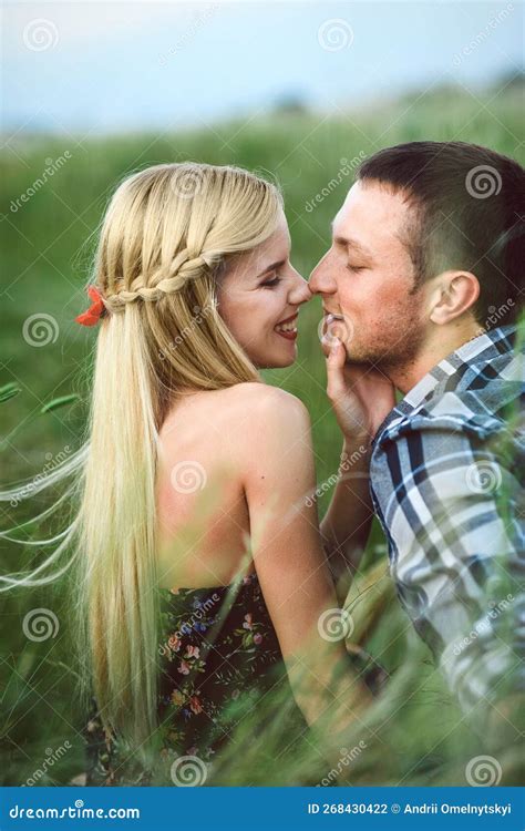 Couple In Love Blonde Girl And Guy In The Grass Stock Photo Image Of Love Field 268430422