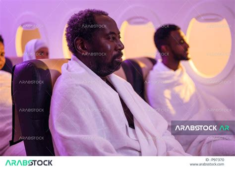 Close Up Of A Black Muslim Man A Group Of Pilgrims Dressed In Ihram