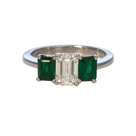 1.13ctw Emerald-Cut Diamond & Emerald Three-Stone Platinum Ring