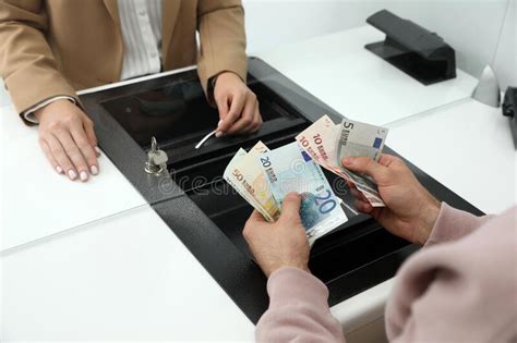 Man Exchanging Money At Cash Department Window Stock Image Image Of