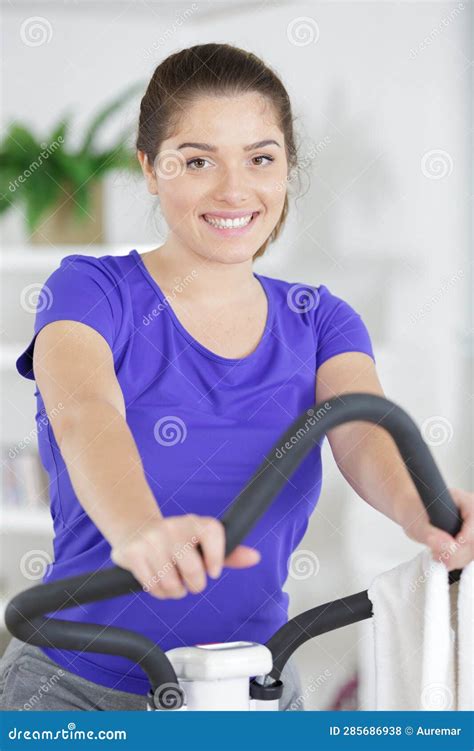 Brunette Stepping On Step Machine At Home Stock Photo Image Of Woman Fitness 285686938