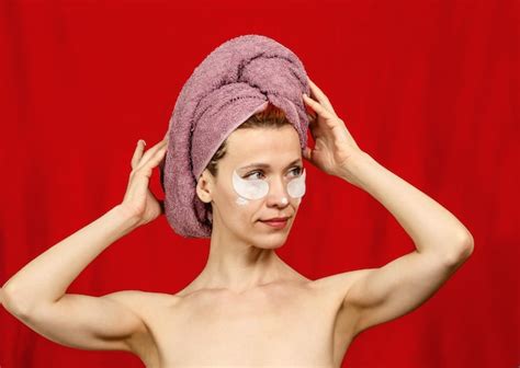 Premium Photo Slender Half Naked Woman With A Towel On Her Head Hands Near The Head