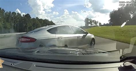 Police vehicle forces fleeing suspects' car off Georgia highway by ...