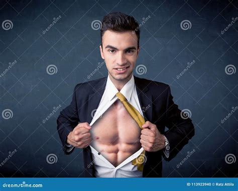 Businessman Tearing Off Shirt And Showing Mucular Body Stock Photo