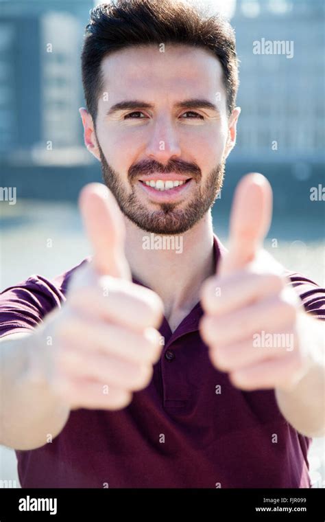 Attractive Young Man Showing Thumbs Up Stock Photo Alamy