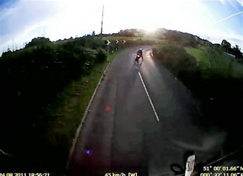 Moment Motorcyclist Survives Crashing Into Lorry After Hitting Pothole