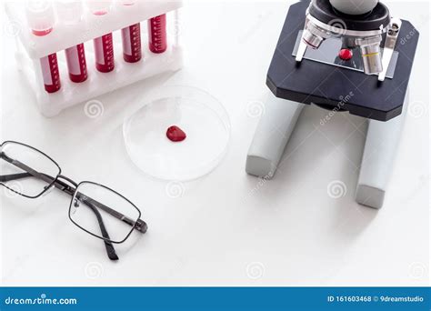 Blood Testing Laboratory Samples Viewing Under Microscope Near Tubes