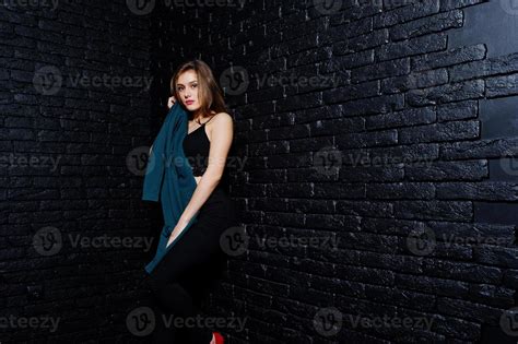 Handsome Brunette Girl Wear On Black Posing At Studio Against Dark Brick Wall Studio Model
