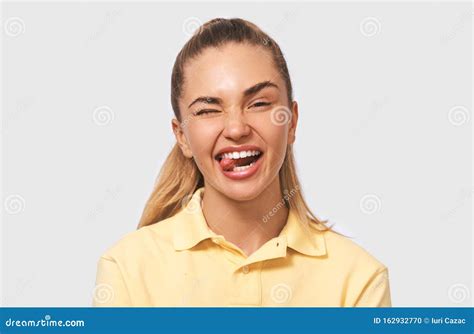 Closeup Portrait Of Funny Young Blonde Woman Making Funny Faces At The