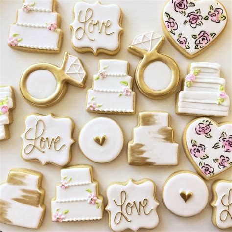 Decorated Cookies Arranged In The Shape Of Heart Wedding Rings And