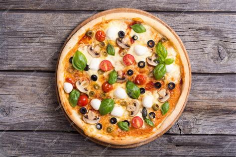 Premium Photo Italian Pizza With Mozzarella Tomato Olives And Mushrooms