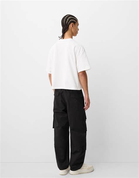 Карго панталон с няколко джоба и широки крачоли - Мъжки | Bershka