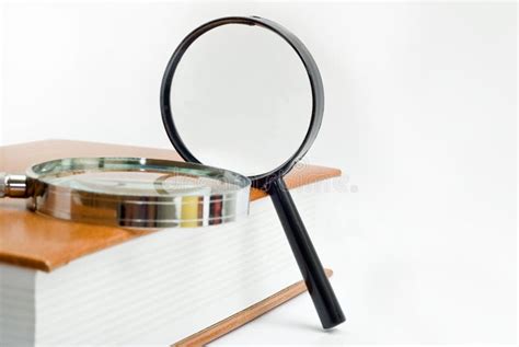 Two magnifier and book stock photo. Image of education - 12206830