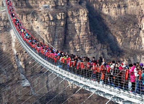 Hundreds Of People Cram Onto Worlds Longest Glass Suspension Bridge