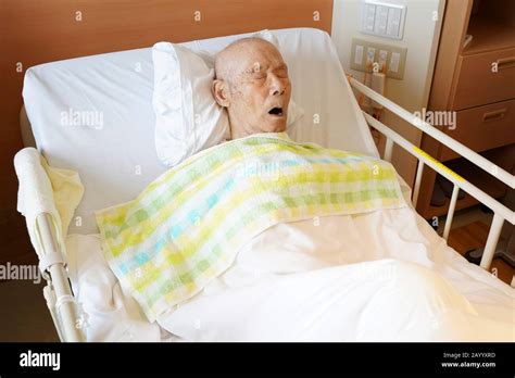 Man Sleeping In Hospital Bed