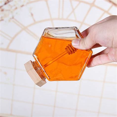 China Customized Hexagonal Glass Honey Jar With Wooden Lid Suppliers And Factory Wholesale