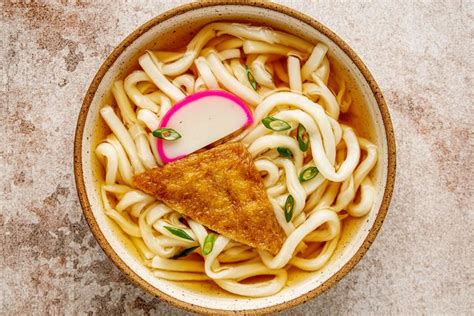 Japanese Kitsune Udon Noodles In Hot Soup With Seasoned Aburaage