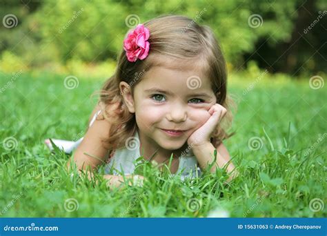 Little Beauty with Green Eyes on Grass Stock Image - Image of smiling ...