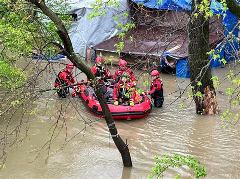 5 Evacuated From Flooded Homeless Camp Next To Rising Creek