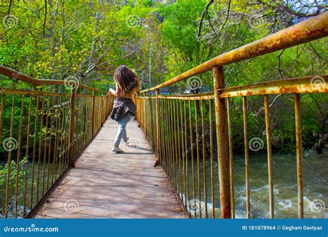 Girl On A Bridge Young Woman On The Bridge Woman Walking On Bridge