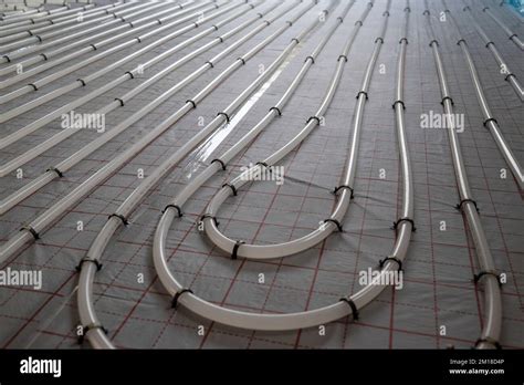 The winding tubes of the hydronic radiant heating system on the floor