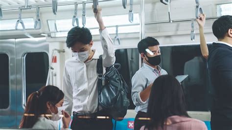 Premium Photo People Wearing Face Masks On A Crowded Public Subway Train