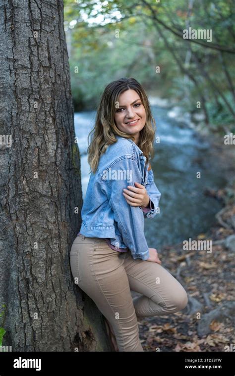 Attractive Young Woman Wearing Denim Jacket Pastel Colors Leaning On