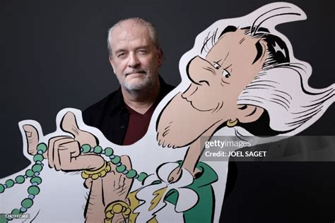 French comics artist Didier Conrad poses next to a giant drawing of... News Photo - Getty Images