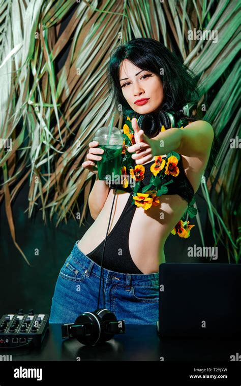 Brunette Girl In Bikini With Cocktail On Tropical Leaves Background DJ