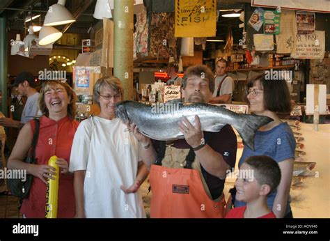 Pike place fish market throwing hi-res stock photography and images - Alamy