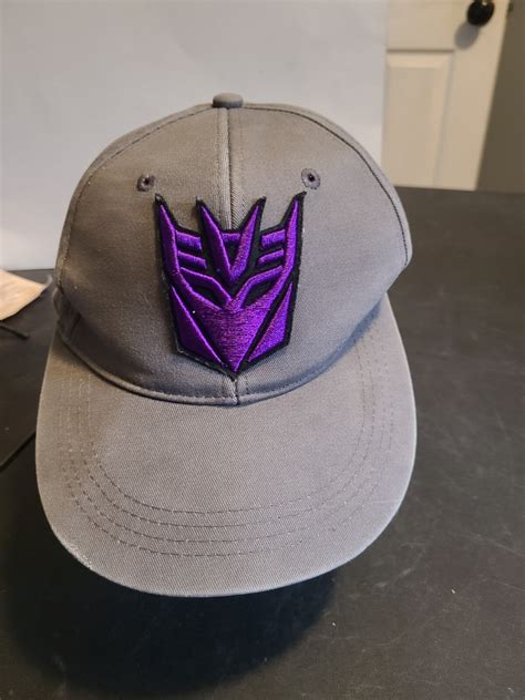 Megatron transformer Universal studios gray baseball. - Gem