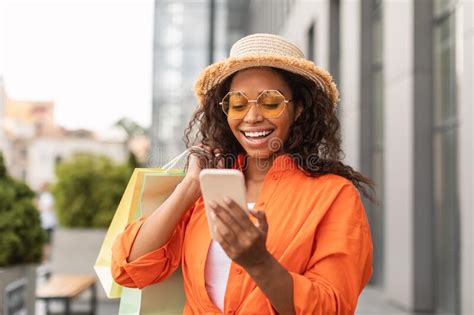 Happy Inspired Millennial African American Lady In Casual Cap And