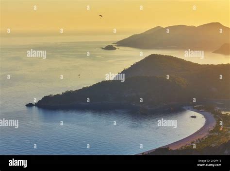 Oludeniz beach and small town of Oludeniz, view from mountain at sunset ...