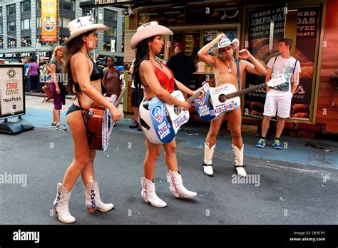 New York MA July 11 2013 Naked Cowgirls And Cowboy Pose For Pictures In Times Square Stock