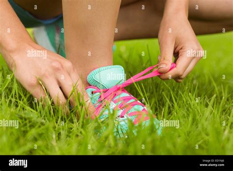 Fit Woman Tying Her Shoelace Stock Photo Alamy