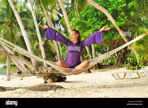 Woman In Hammock On Beach Stock Photo Alamy