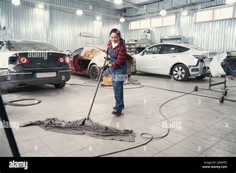 Car Mechanic In Workshop Cleaning Hi Res Stock Photography And Images