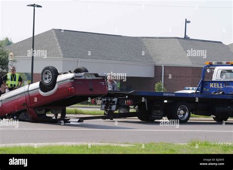 Overturned Vehicle Being Uprighted By Tow Truck Stock Photo Alamy