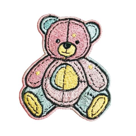 Um urso de pelúcia rosa amarelo e azul em suas cores rosa e amarela