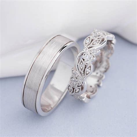 Wedding bands set with floral design. His and hers wedding rings ...