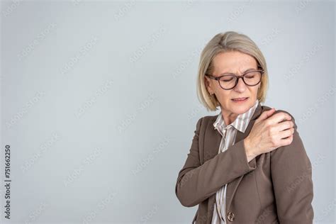 Senior Woman With Shoulder Pain Elderly Business Woman Is Enduring