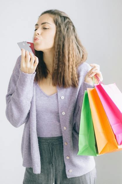 Premium Photo A Woman Holding Paper Bags And Cards Stock Photo